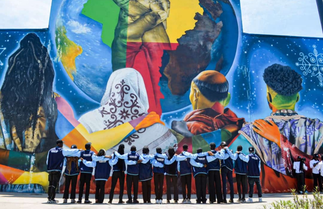 Students at a cultural mural in Benin Republic